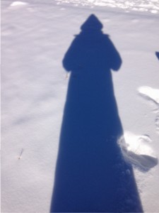 shadow on snow looks like grim reaper in winter, morning exercise