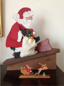 Santa Claus figurine entering chimney