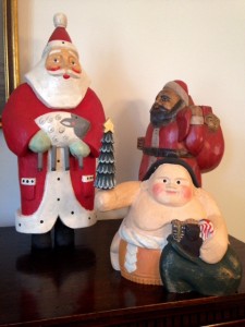 three Santa Claus figurines